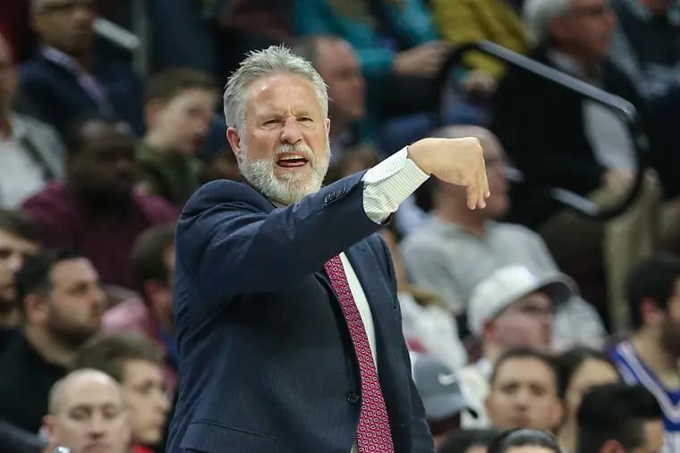Sixers' head coach Brett Brown calls plays against the  Raptors during the 1st quarter at the Wells Fargo Center in Philadelphia, Tuesday, February 5, 2019.   STEVEN M. FALK / Staff Photographer