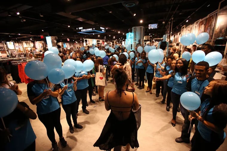 Primark employees greet shoppers during the store’s grand opening at Willow Grove Park Mall.