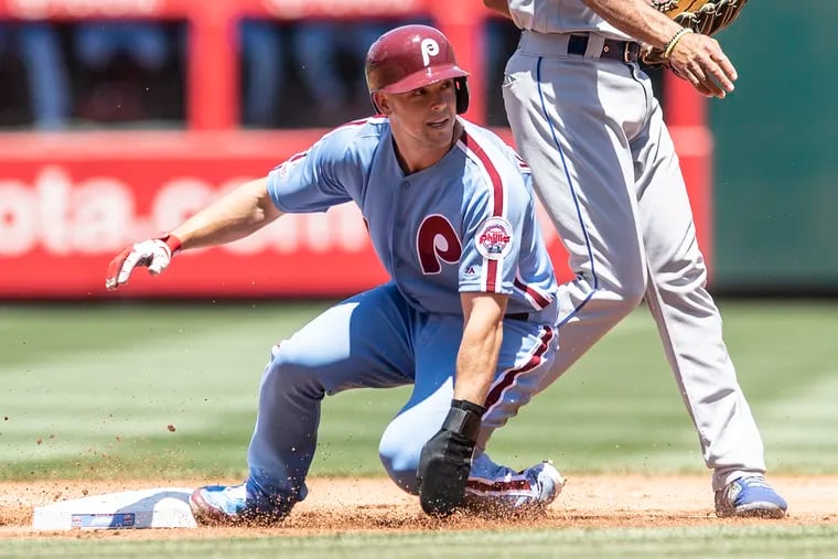 Phillies, Scott Kingery, looks back after getting tagged out on second base by New York Mets, Jeff McNeil, (6) in the first inning of the game, Thursday, June 27, 2019 at Citizens Bank Park in Philadelphia, PA.