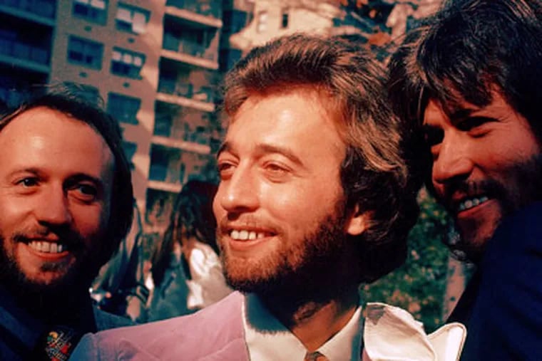 FILE- In this undated file photo, from left, members of The Bee Gees Musical Group, Maurice Gibb, Robin Gibb, Barry Gibb pose for a photo. A representative said on Sunday, May 20, 2012, that Gibb died at the age of 62. (AP Photo)