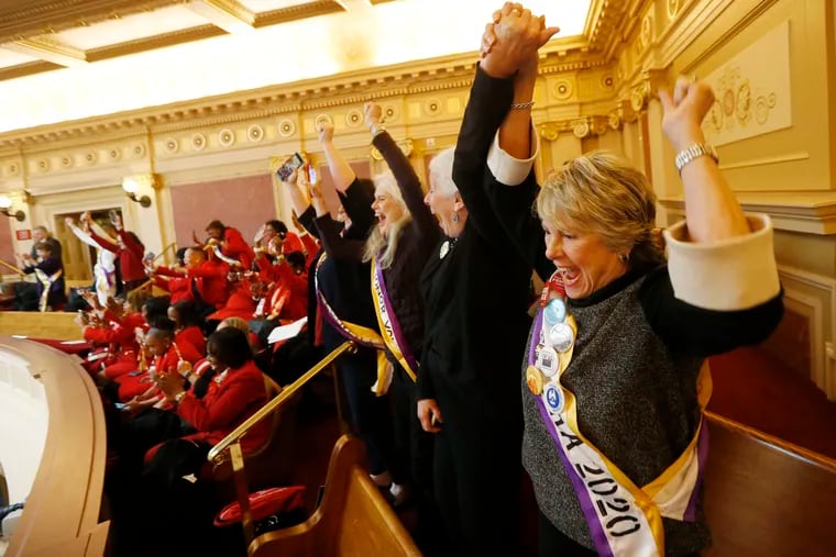 FILE This Monday, Jan. 27, 2020 file photo shows Equal Rights Amendment supporter Donna Granski, right, from Midlothian Va., cheering the passage of the House ERA Resolution in the Senate chambers at the Capitol in Richmond, Va. The resolution passed 27-12. In a state once synonymous with the Old South, Democrats are using their newfound legislative control to refashion Virginia as the region's progressive leader on racial, social, and economic issues. (AP Photo/Steve Helber)