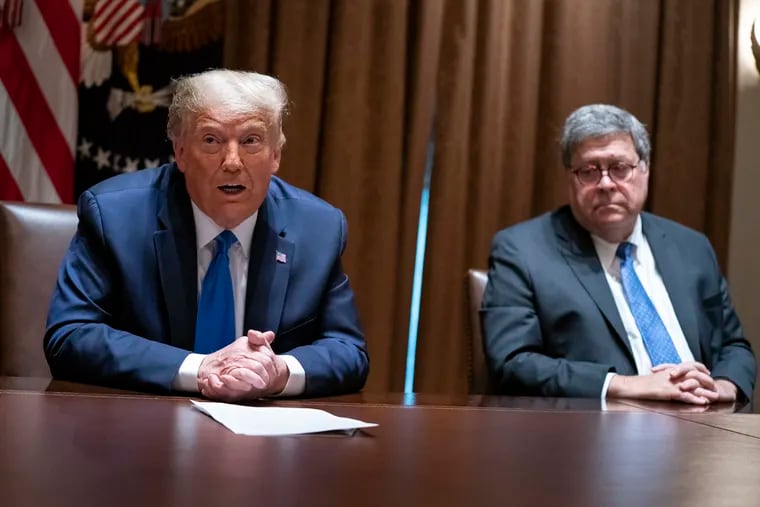 President Donald Trump, with Attorney General William Barr, during a meeting Wednesday in the Cabinet Room of the White House.