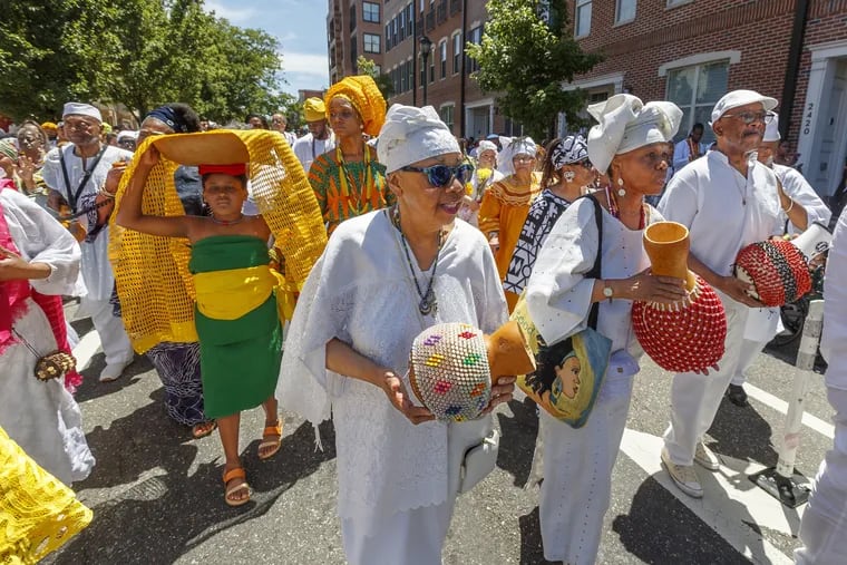 At the 2019 Odunde Festival, musicians played a shekere,  and African gourd instrument, and helped lead the procession to the South Street Bridge where an offering of fruits and flowers was tossed into the Schuylkill River to honor the deity Oshun.