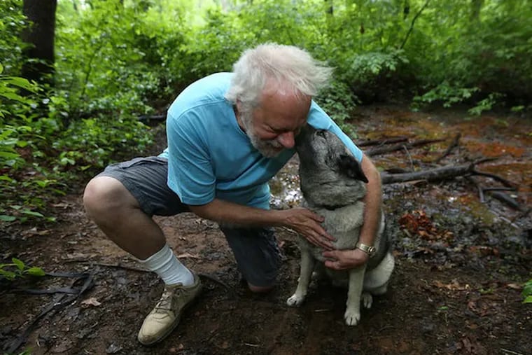 Robert M. Kelley and his dog, Cocoa Bear, in Crows Woods in Haddonfield, site of an earlier, more elemental adventure.