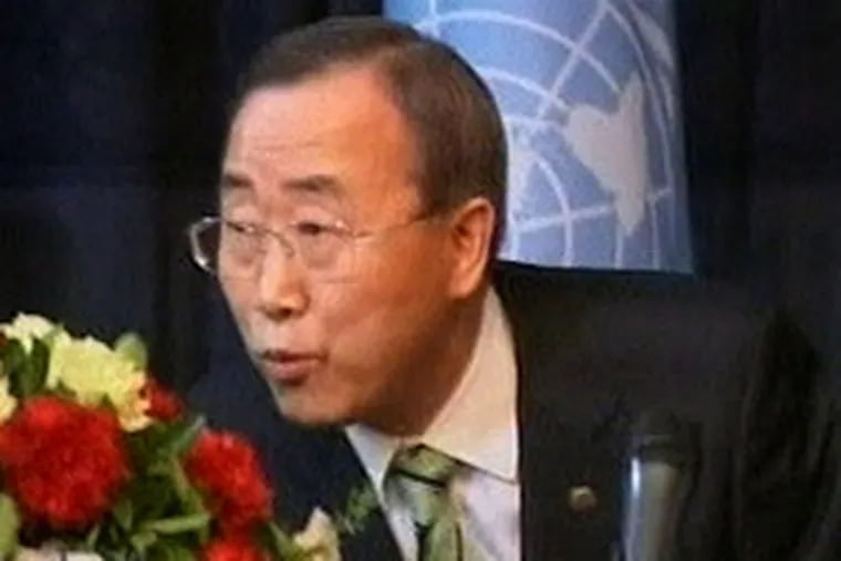 In an image made from television, U.N. Secretary-General Ban Ki-moon ducks as a rocket struck nearby.