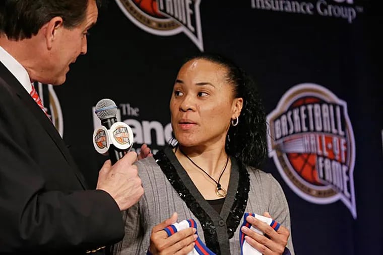 Three-time Olympic gold medalist Dawn Staley talks with CBS announcer Jim Nantz, left, during the Naismith Memorial Basketball Hall of Fame class announcement, Monday, April 8, 2013, in Atlanta, Georgia. (AP Photo/Charlie Neibergall)
