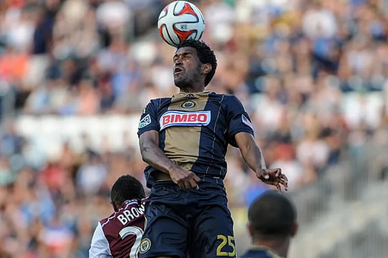 Sheanon Williams (25) heads the ball during the first against the Colorado Rapids at PPL Park. (John Geliebter/USA Today)