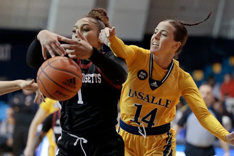 Charity Shears (14) battles for a rebound during La Salle's game against UMass on Saturday.