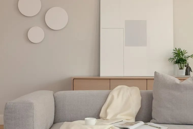 Kashi Shikunova chose a warm white paint color for this room in Bina Gardens in London. To create visual interest, she suggests layering shades of neutrals that complement and contrast.