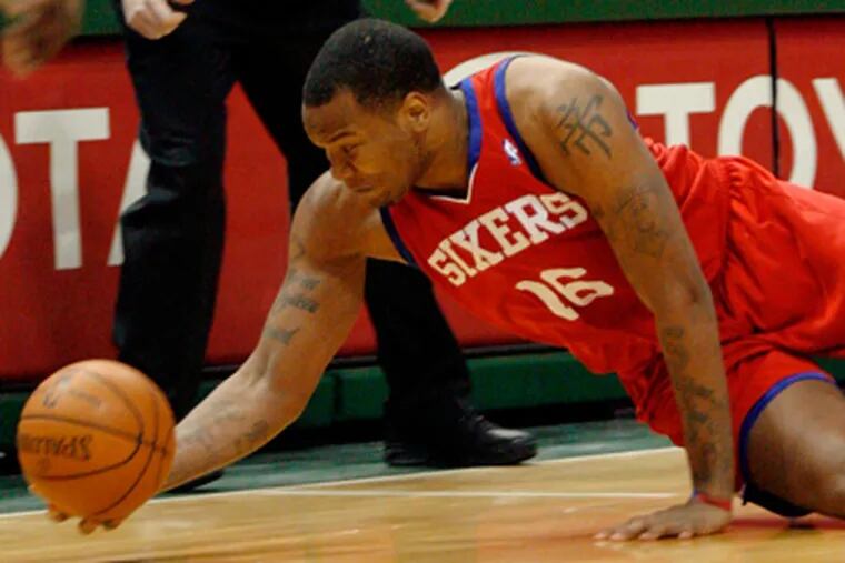 Marreese Speights dives for a loose ball against the Milwaukee Bucks.  The Sixers lost to the Bucks, 91-88. (AP Photo/Darren Hauck)