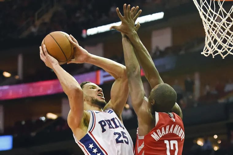 Philadelphia 76ers guard Ben Simmons, left, shoots as Houston Rockets forward Luc Mbah a Moute defends during the second half of an NBA basketball game, Monday, Oct. 30, 2017, in Houston. Philadelphia won 115-107. (AP Photo/Eric Christian Smith).