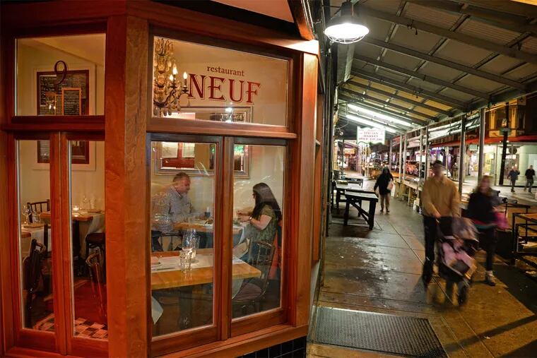 Rita and Jim Yost of Philadelphia dine at Restaurant Neuf, under the awnings over Ninth Street.