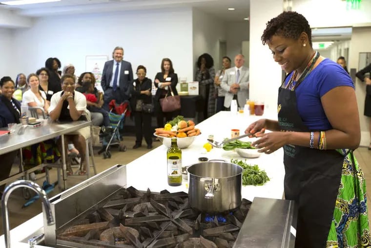 Dejenaba Gordon prepares collard greens at the Free Library Culinary Literacy Center on Wednesday, June 3, 2015.