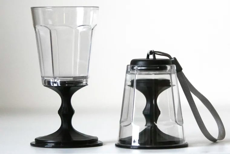 Portable, collapsible wine glasses sit side by side.