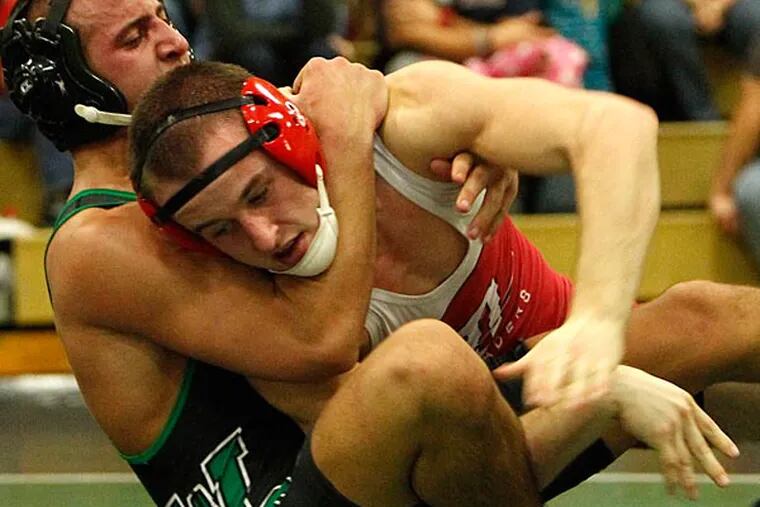 W. Deptford's Cristen Terinoni tries to handle Delsea' Ryan Lamanteer,
but Lamanteer eventually got the upper hand. Delsea at West Deptford
in wrestling match on Friday, December 21, 2012. ( Ron Cortes / Staff
Photographer )