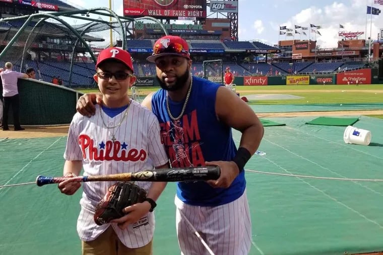 Anthony Garcia, who has leukemia, met Carlos Santana before Saturday's game.