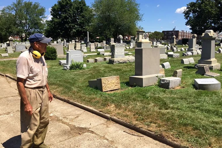 Groundskeeper John Gibson surveys the markers that were toppled at the Adath Jeshurun Cemetery in Frankford. (KRISTEN A. GRAHAM/Staff)