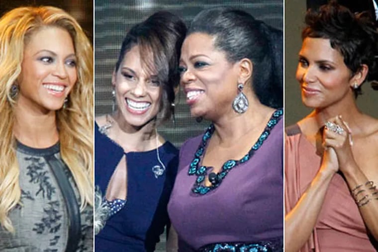 From left, Beyonce Knowles, Alicia Keys, Oprah Winfrey and Halle Berry. (AP Photo / Charles Rex Arbogast)