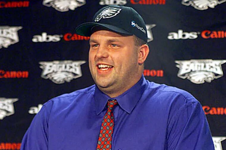 Jon Runyan laughs during a press conference after signing a 6-year, $30 million deal with the Philadelphia Eagles Monday, Feb. 14, 2000, in Philadelphia. (AP Photo/Dan Loh)