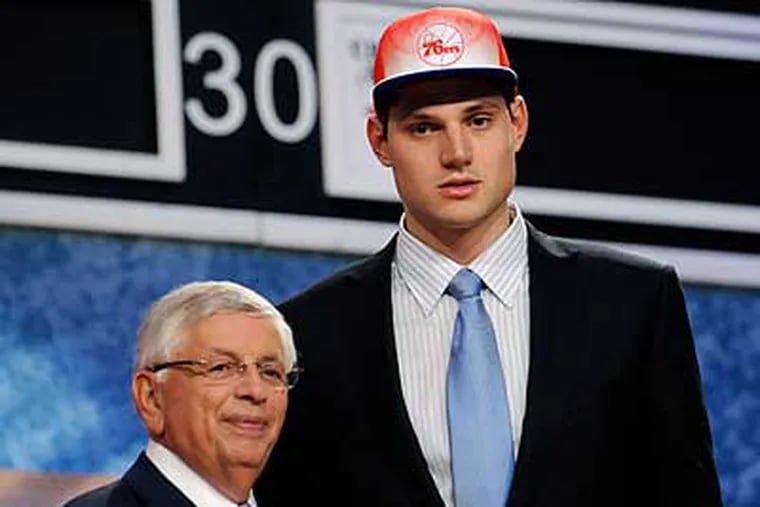 Nikola Vucevic poses with NBA Commissioner David Stern after being selected by the Sixers in the first round. (Bill Kostroun/AP)
