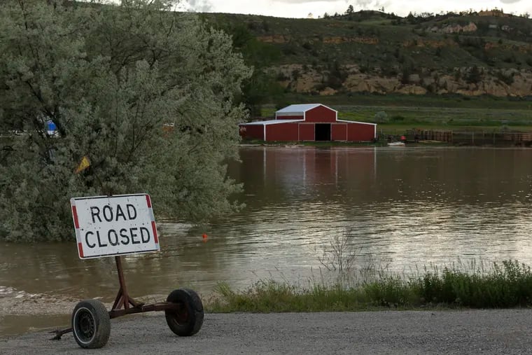Floodwaters are seen along the Clarks Fork Yellowstone River near Bridger, Mont., on Monday.
