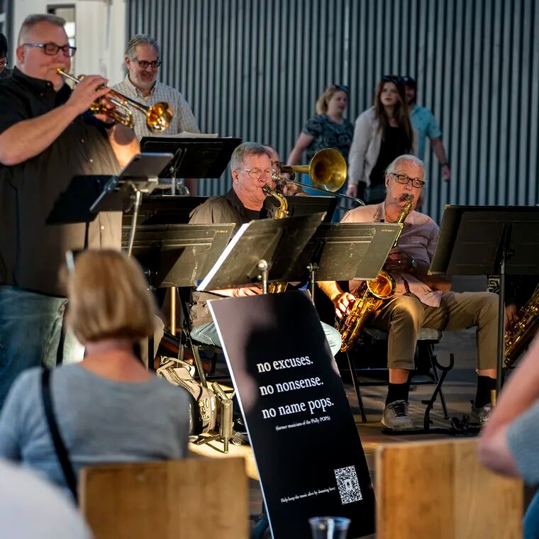 Band leader Matt Gallagher (left) is on trumpet as the “No Name Pops” performs a free big band concert on the Cherry Street Pier, May 25, 2023.