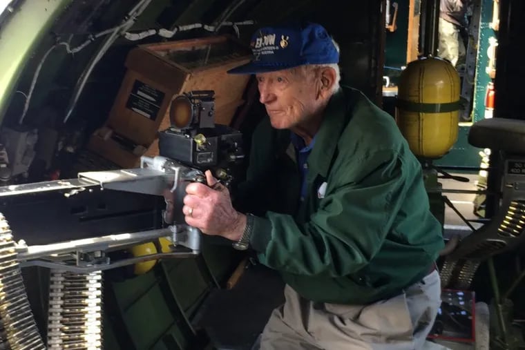 Francis Dewey Burk, then 90, seen on a reconditioned B-17 bomberon Long Island, N.Y.in May 2014. As a waist gunner in World War II, he occupied that small space in the plane just above the ball turret.
