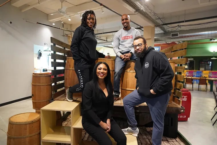 Chefs from Everybody Eats Philly (from left) Aziza Young, Stephanie Willis, Malik Ali, and Kurt Evans on a pickup truck set up in the Vittles Food Hall in Chester, Pa.