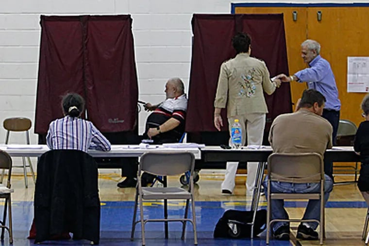File: The polls at Glen Landing Middle School in Gloucester Township. &quot;School board elections don't attract a large amount of voters,&quot; said a teacher. (Akira Suwa / Staff Photographer)