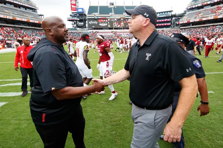 Temple head coach Rod Carey (right), here shaking hands with Maryland coach Michael Locksley, said he was protecting his players by not allowing them to talk to reporters after Saturday's loss.