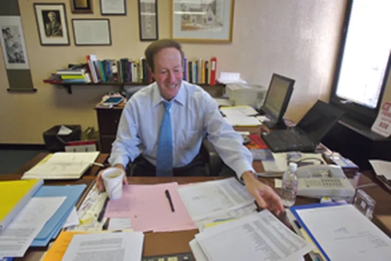 Temple University's law school dean, Robert Reinstein, in his office. Reinstein announced today that he will step down at the end of the current academic year.