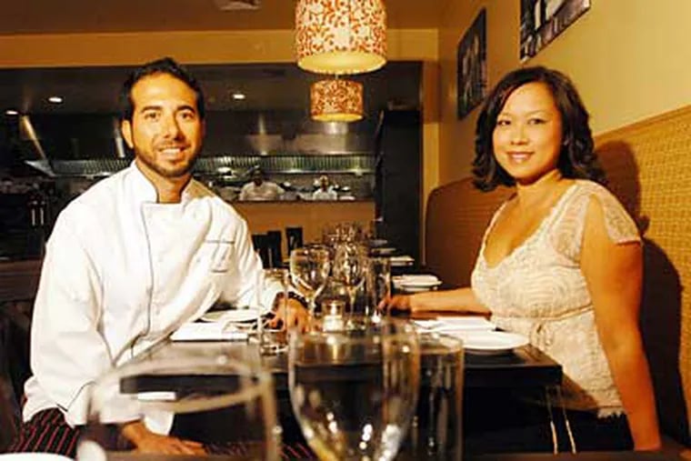 Melograno now makes its trattoria magic in a long, butter-colored, rustic dining room. Left, chef Gianluca Demontis and Rosemarie Tran, the owners.