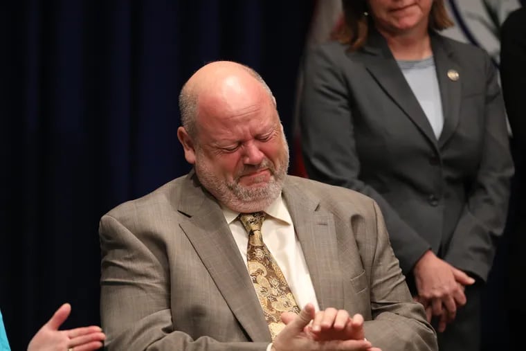 Jim Faluszczak reacts as Pennsylvania Attorney General Josh Shapiro releases the findings of a two-year grand jury investigation into clergy abuse.