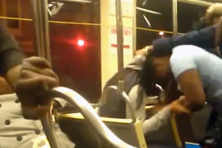 A screenshot from a video showing a brawl on a SEPTA trolley.