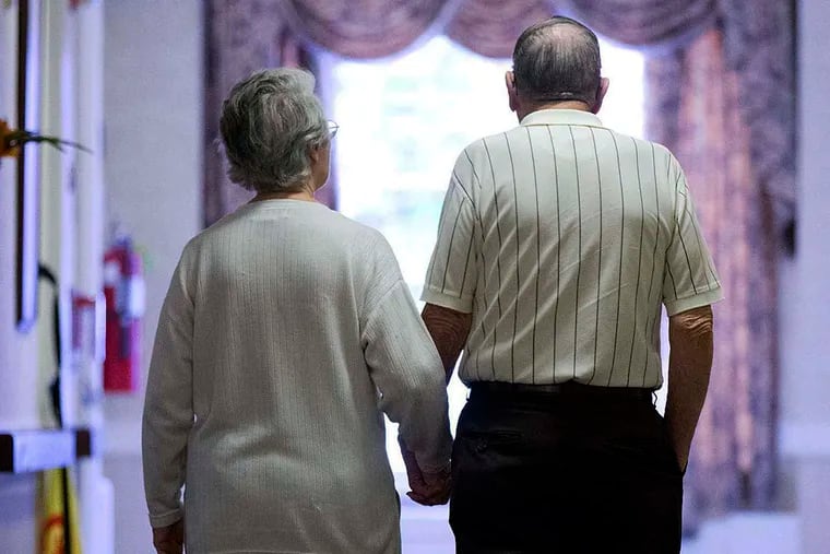 FILE photo shows an elderly couple. Long-term care insurance is a critical tool used by the older population to pay for assistance with day-to-day activities such as bathing, dressing and eating meals.