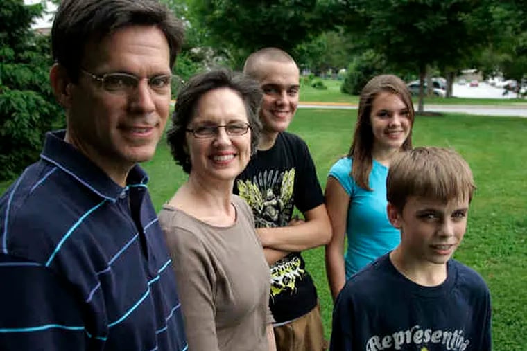 The Kunz family - Milan; his wife, Leslie; and their children, Dan (center), Sarah, and Matt- will move from Downingtown to Nebraska, where Milan will supervise 142 missionaries.