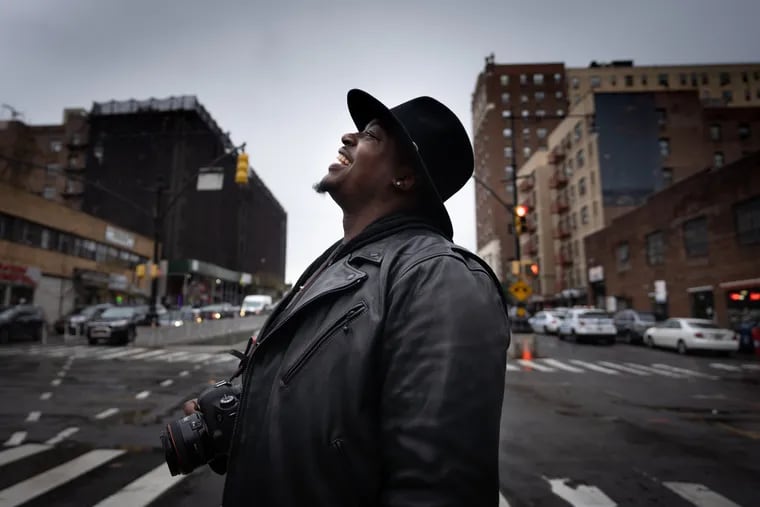 Andre Whitehead, shown here near the South Bronx NeON, took advantage of photography classes offered at the probation office and discovered a new career path.
