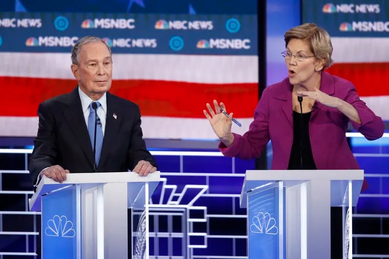 Democratic presidential candidates Elizabeth Warren and Mike Bloomberg during Wednesday's combative primary debate in Las Vegas.