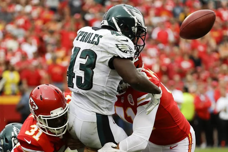 Eagles Darren Sproles fumbles the football against the Chiefs.