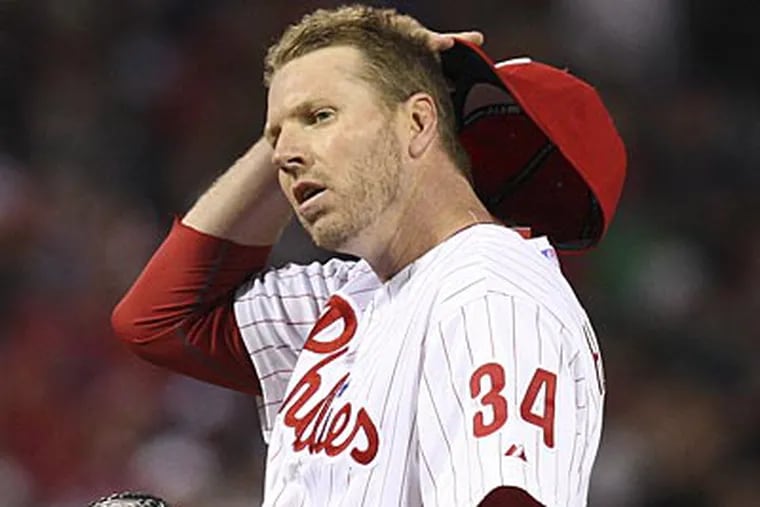 Roy Halladay pitched seven innings, allowed three runs and struck out five against the Cubs. (Steven M. Falk/Staff Photographer)