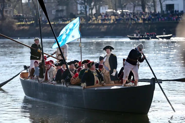 A 2016 file photograph shows that year's reenactment of George Washington leading the crossing of the Delaware River in 1776.