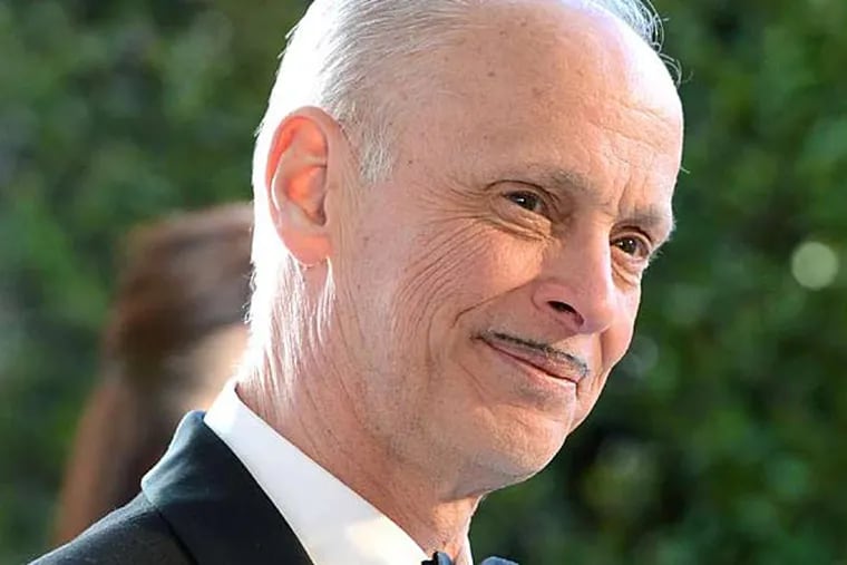 Film director John Waters writes about his hitchhiking odyssey from Baltimore to San Francisco in his new book &quot;Carsick.&quot; He will discuss the book at the Free Library on Friday night.