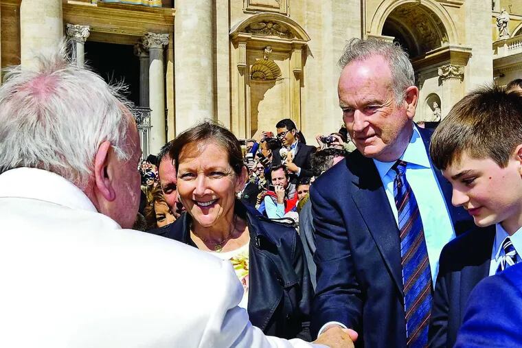 Pope Francis shakes hands with Bill O'Reilly after his weekly general audience in St. Peter's Square, Vatican City, on Wednesday.