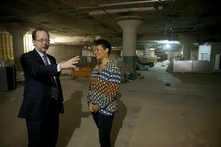Pennsylvania Academy of the Fine Arts CEO David Brigham and trustee Sara Lomax-Reese tour the basement space where demolition has begun to make way for a  new concert hall.