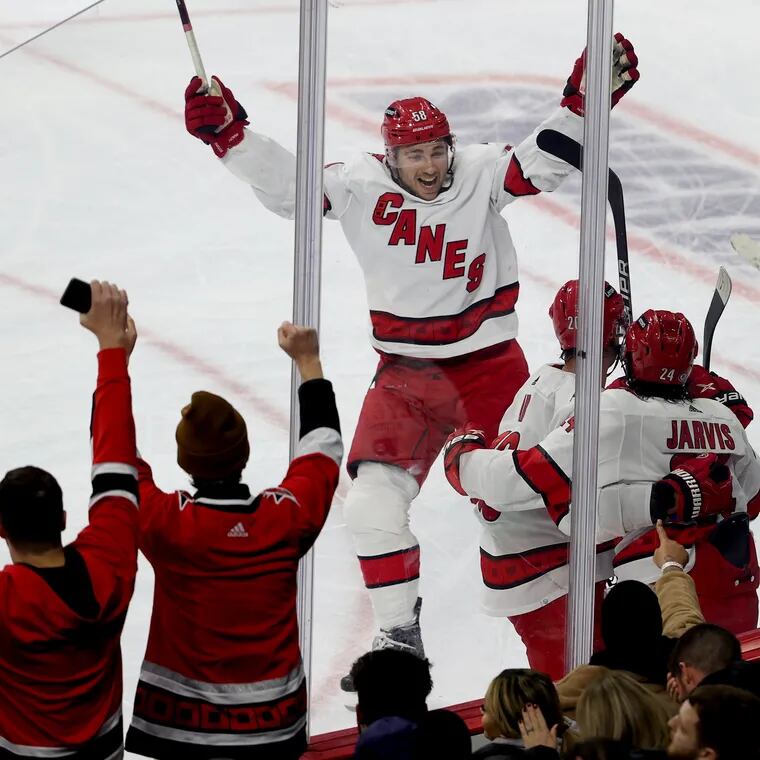 Members of the Carolina Hurricanes celebrate a goal by Seth Jarvis during the 3rd period which gave them a 3-1 lead at the Wells Fargo Center on Nov. 28 2023.