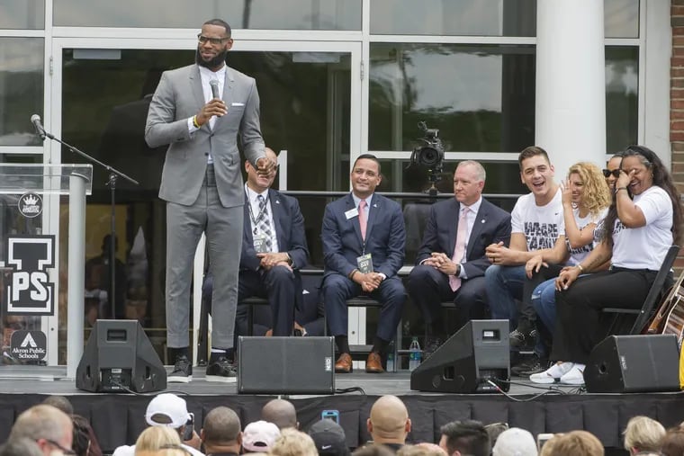 LeBron James speaks and gets a laugh from his mother, Gloria, right, at the opening ceremony for the I Promise School in Akron, Ohio, Monday, July 30, 2018. The I Promise School is supported by the The LeBron James Family Foundation and is run by the Akron Public Schools.