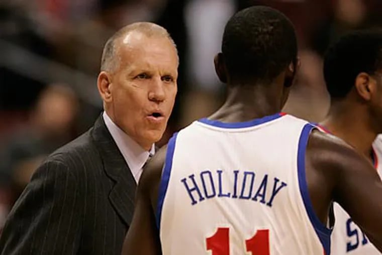 Doug Collins is hoping his younger players like Jrue Holiday, and Evan Turner can become more vocal. (Michael Bryant/Staff Photographer)