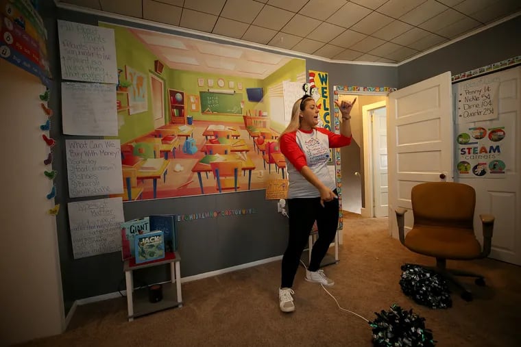 Michelle Ettore, who is an autistic support teacher at the Lamberton elementary school, teaches from her home in Bridgeport, Pa. on March 3, 2021. Ettore decorated a spare bedroom in her home to look like a classroom as the pandemic forced schools to go to remote learning.