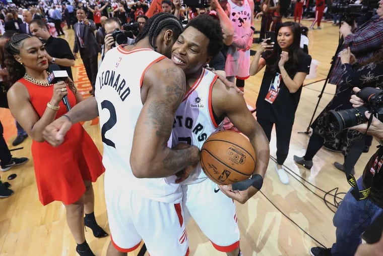 Kyle Lowry (right) and Kawhi Leonard led the Raptors to 16 offensive rebounds to the Sixers' 5.