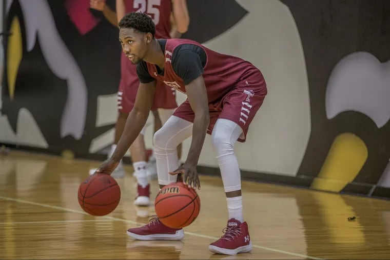 Temple’s Shizz Alston Jr. dribbles two balls at once during a practice on Temple media day in October.